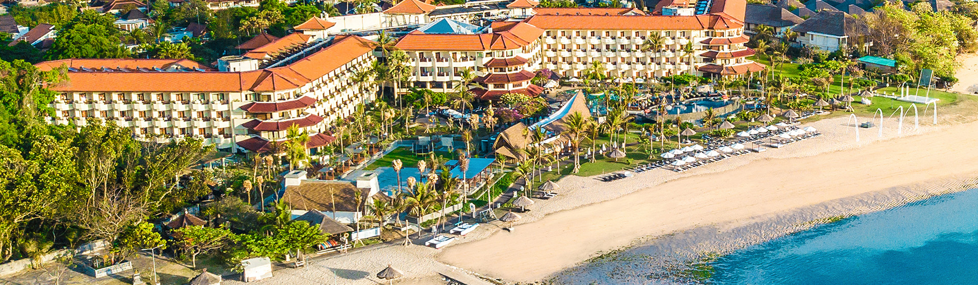 Aerial view of Grand Mirage Resort and Thalasson Spa adjacent to a private beach in Tanjung Benoa, Nusa Dua, Bali, Indonesia