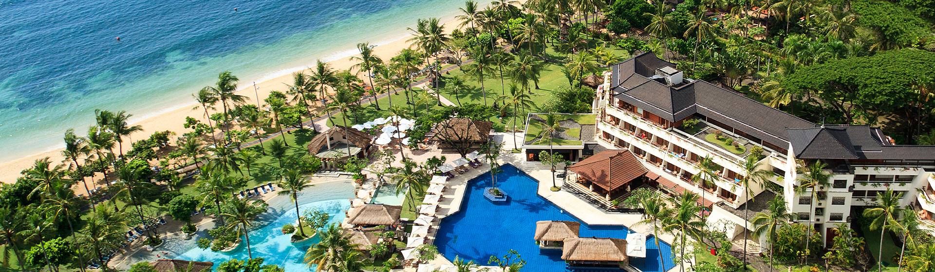 Aerial view of Nusa Dua Beach Hotel & Spa adjacent to the beach in Bali, Indonesia