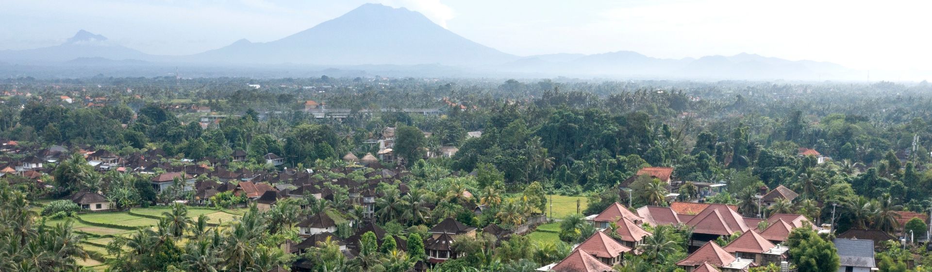 Aerial view of Sakti Garden Resort set against a mountain range in Ubud, Bali, Indonesia