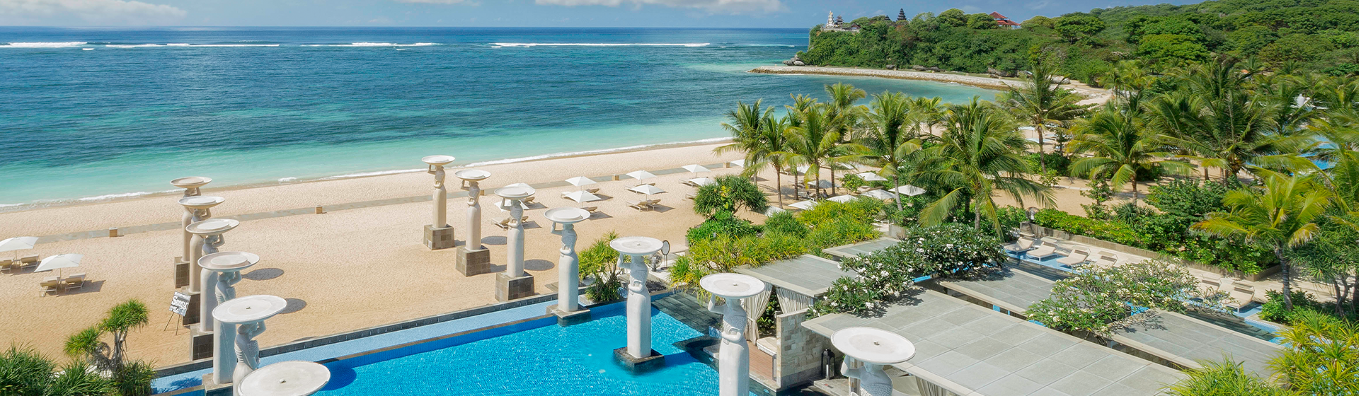 Aerial view of pool area adjacent to the beach at The Mulia, Nusa Dua in Indonesia
