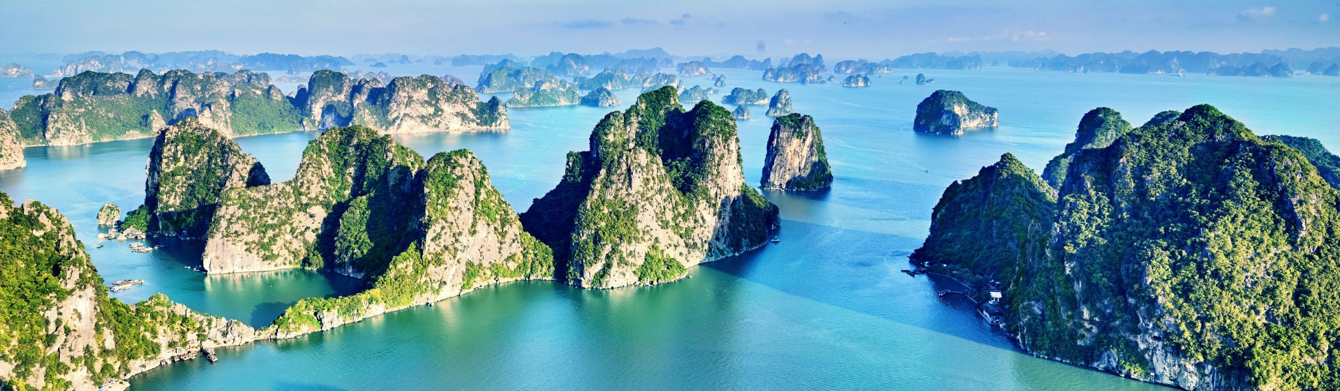 Aerial view of dramatic limestone karsts in the waters of Lan Ha Bay, Vietnam
