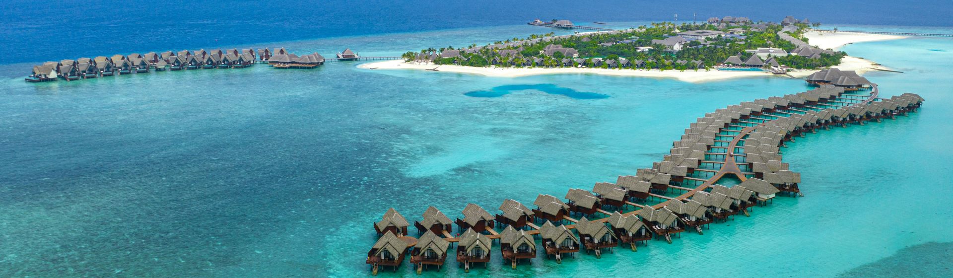 Aerial view of overwater villas at Heritance Aarah Resort in Raa Atoll, Maldives