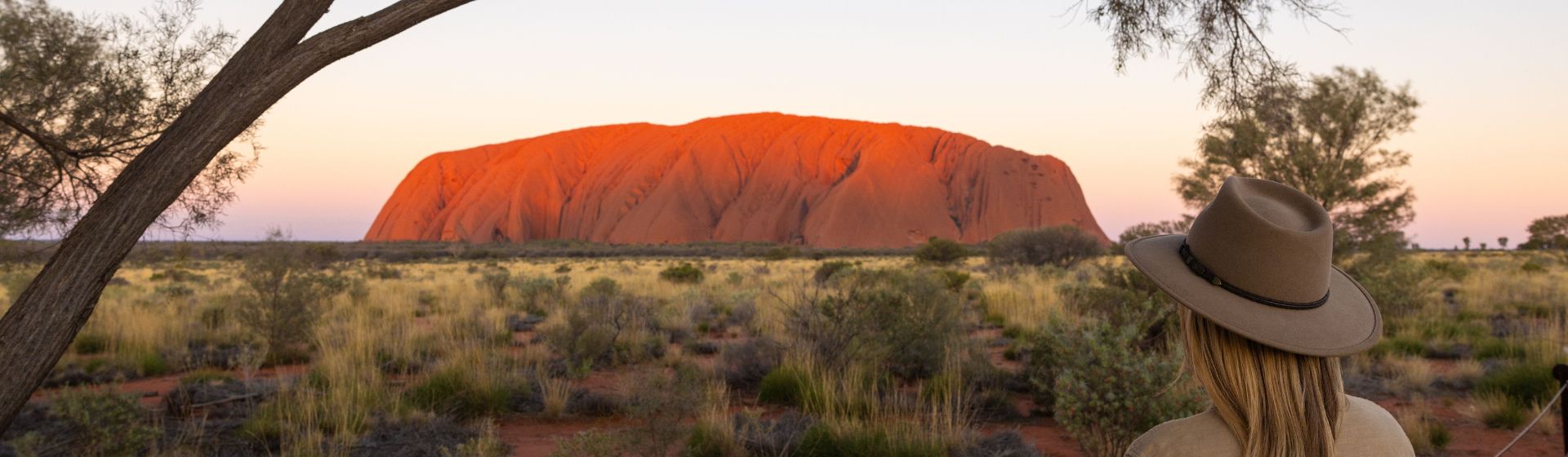 A lady looking at Uluru at Uluru-Kata Tjuta National Park, Northern Territory, Australia
