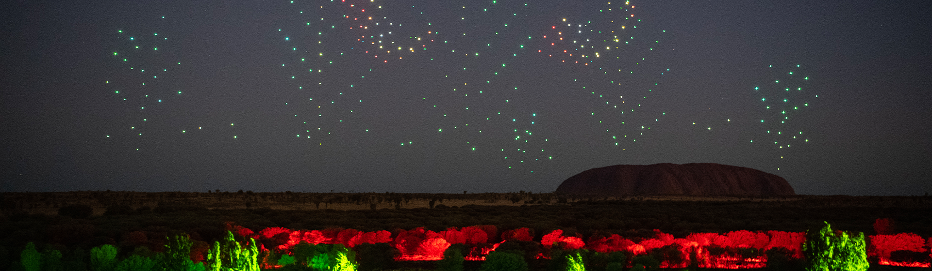 Drones lit with LEDs creating a formation in the sky for Wintjiri Wiru, Northern Territory