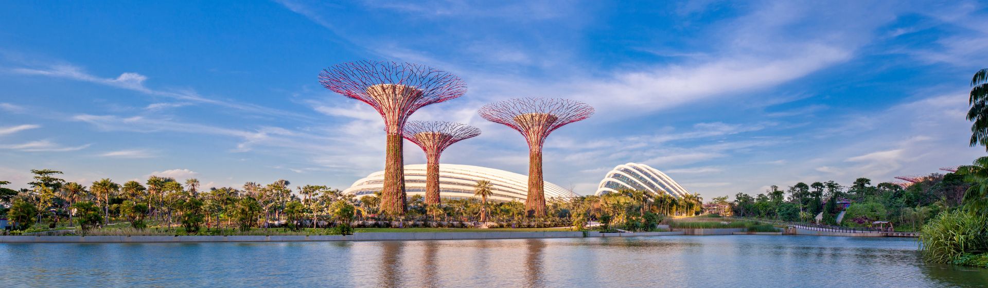 View across the river of the Supertrees and Floral Domes at Gardens by the Bay in Singapore