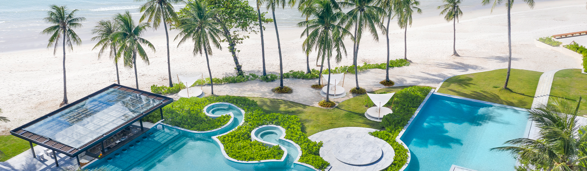 Aerial view of pool area at Centara Reserve Samui, located next to Chaweng Beach, Thailand
