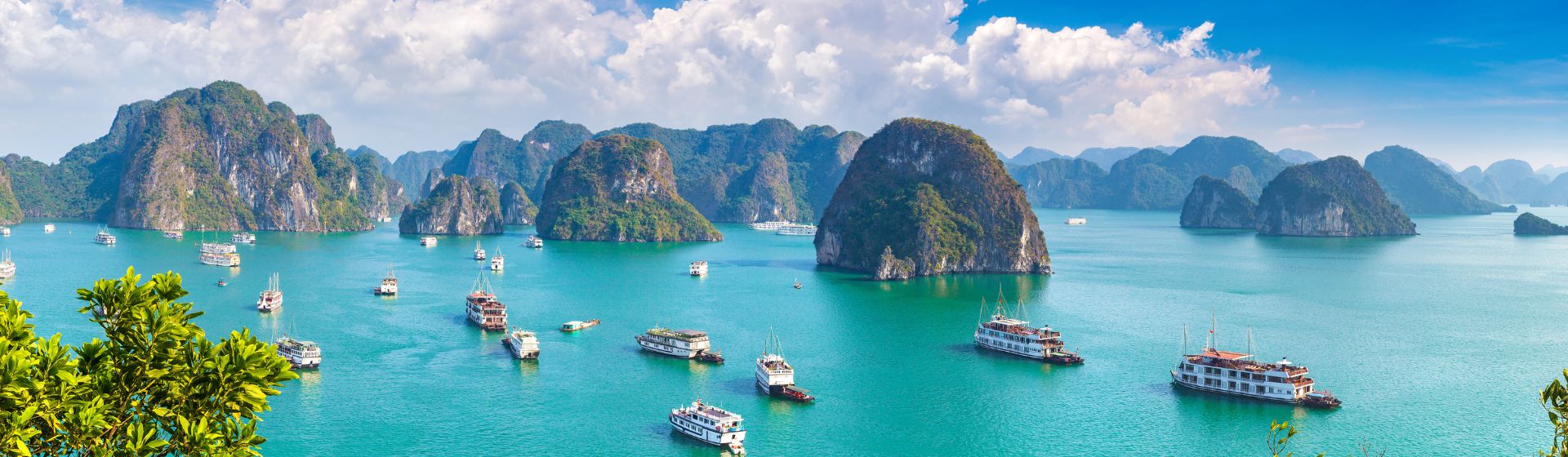 Aerial view of various ships sailing amongst the karsts in Ha Long Bay, Vietnam