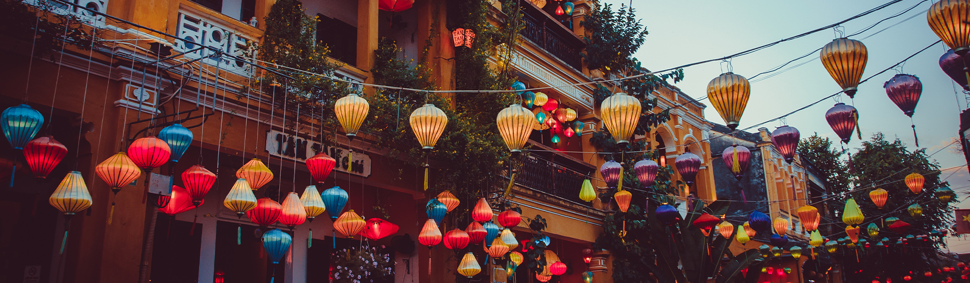 Colourful lanterns hanging across the street in Hoi An, Vietnam