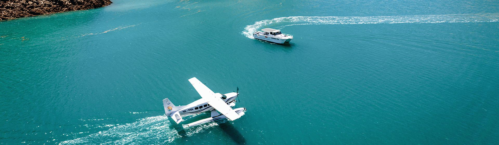Aerial view of seaplane and boat in the waters near Horizontal Falls, Western Australia